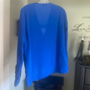 Like new polyester blouse in blue. Brand is Bebe.